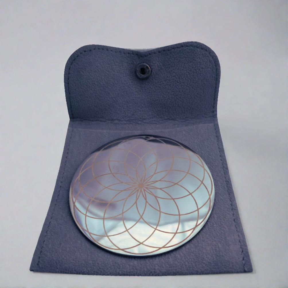 Visually - A Stainless steel coaster with a big beautiful eternal lotus geometric engraving, accompanied with a micro fibre pouch.